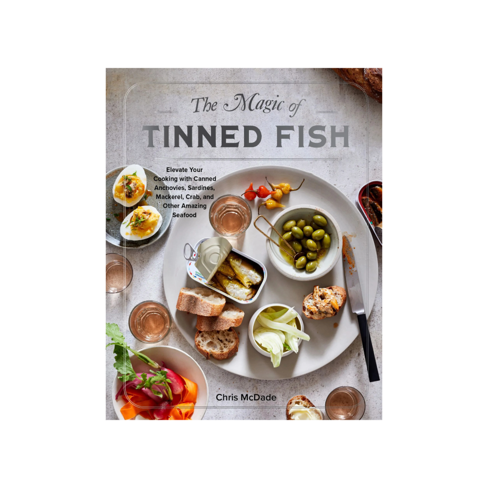 Book cover of 'The Magic of Tinned Fish' with food images and title text.